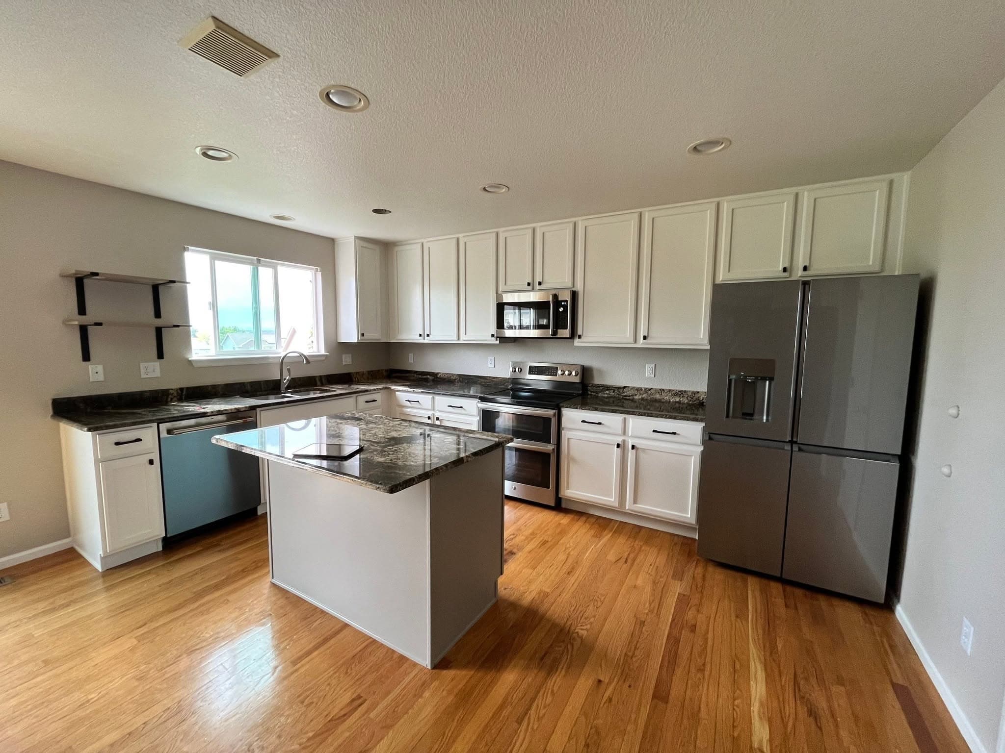 Kitchen cabinets after Helix Painting refinishing