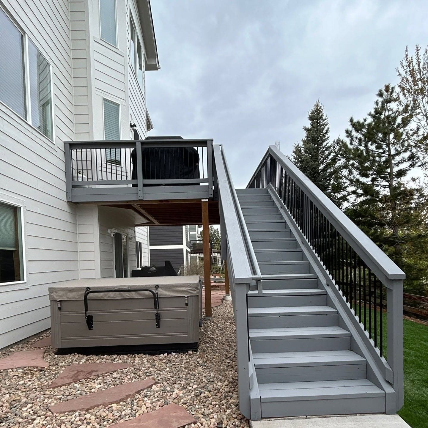 Deck staircase and railings refinished in gray