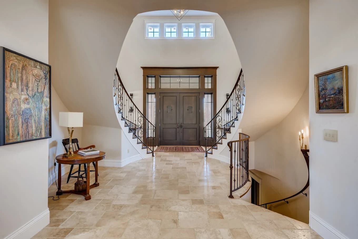 Two-storey entry hall with a repainted staircase and landing