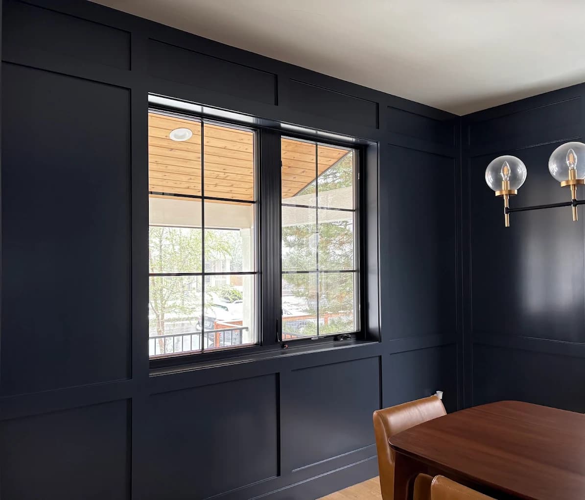 Dining room panelled and painted in deep navy