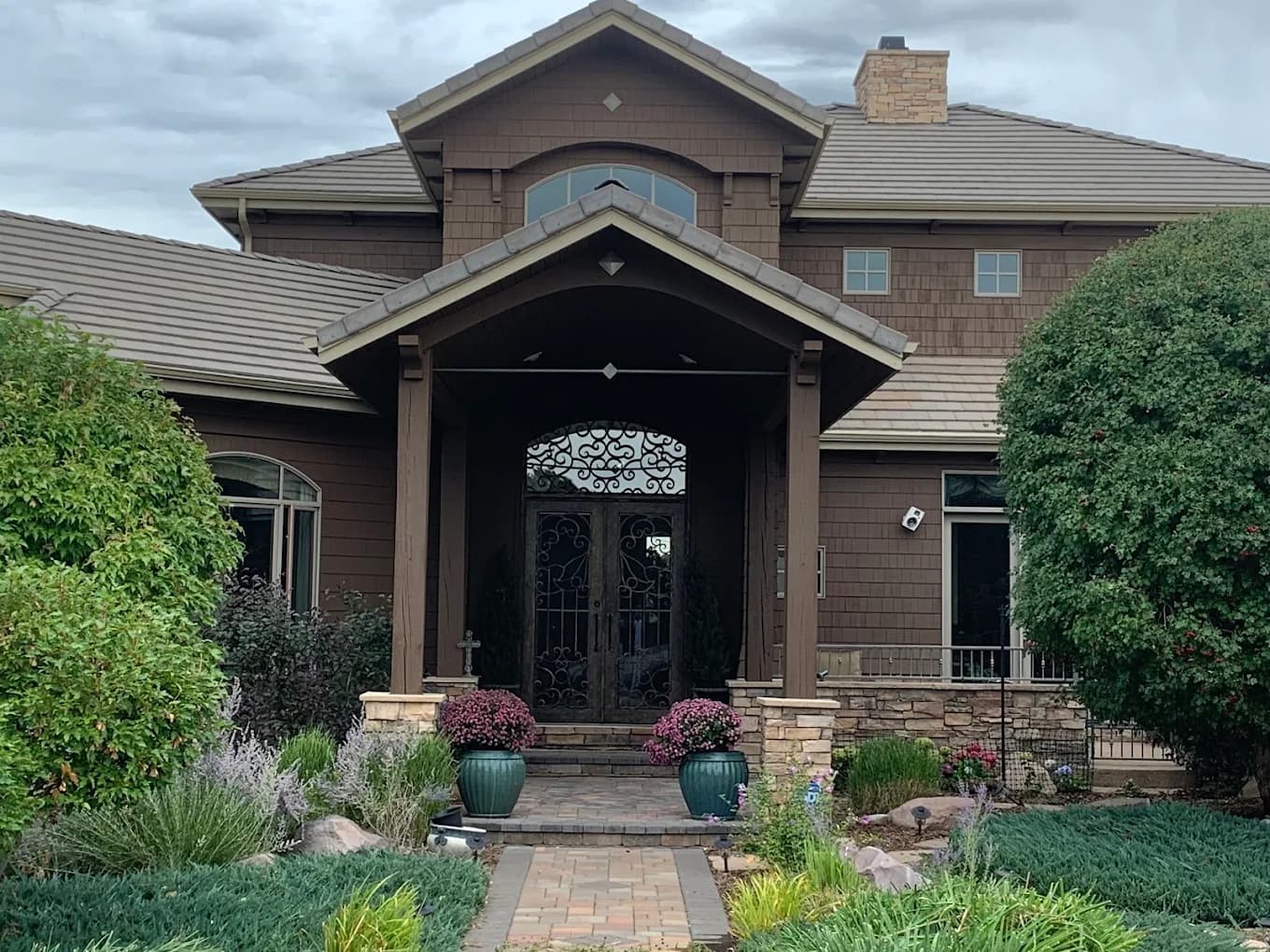 Stone porch and timber front door after a Helix repaint