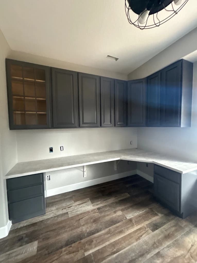 Built-in office cabinetry in navy and white