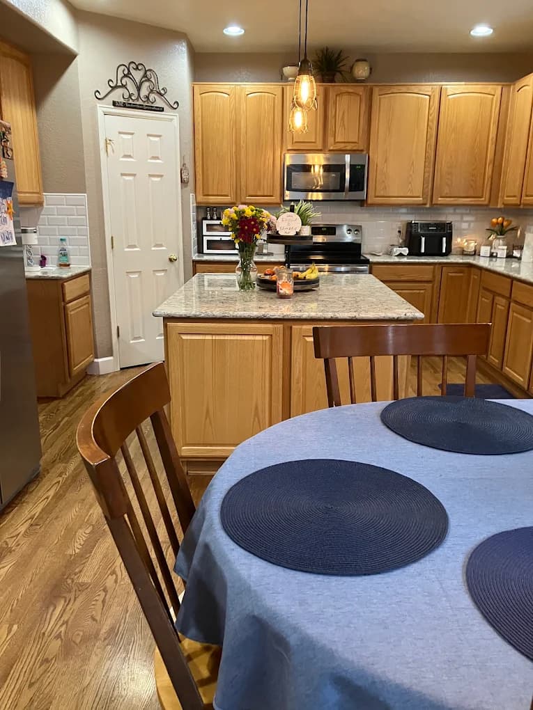 Oak kitchen with an island and dining table