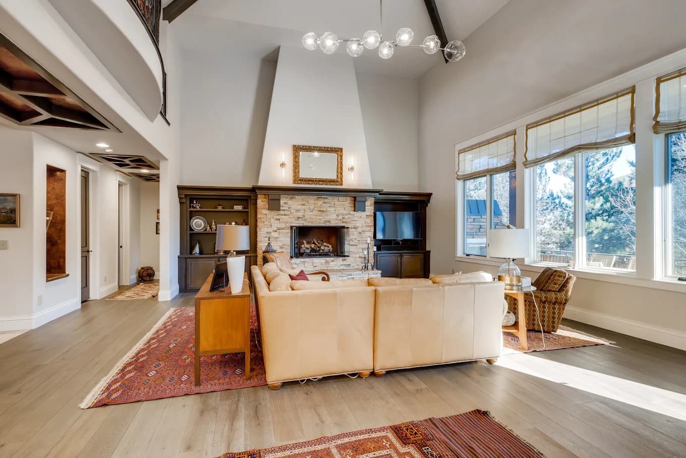 Great room under a smooth vaulted ceiling and exposed beam