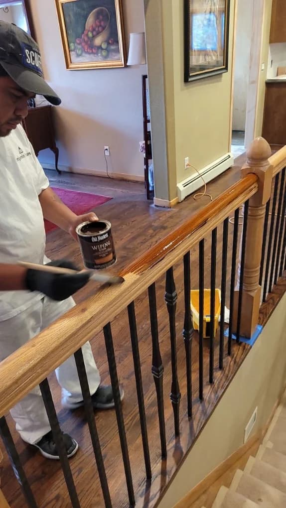 Stair railing masked and tools laid out mid-project