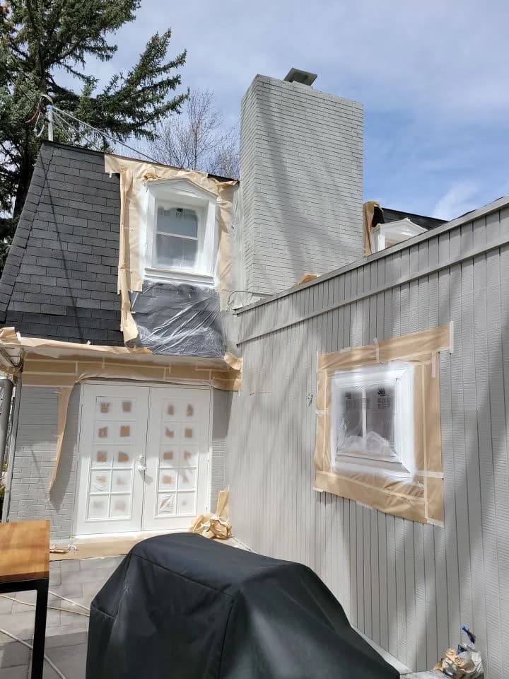 Exterior windows masked and wrapped before spraying