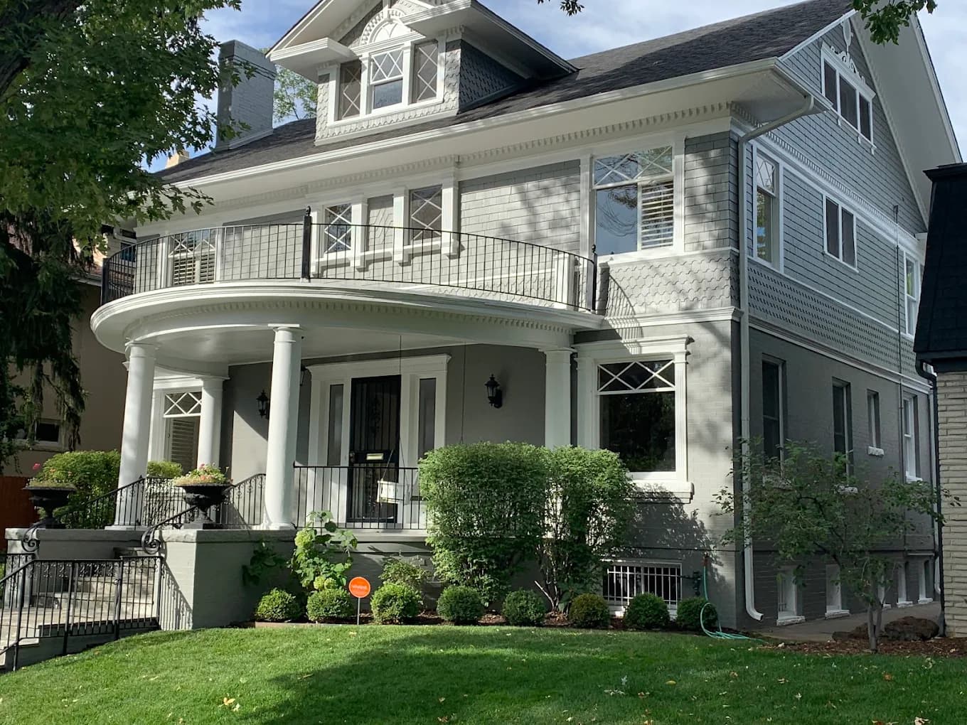 White Victorian home with black trim after a Helix repaint