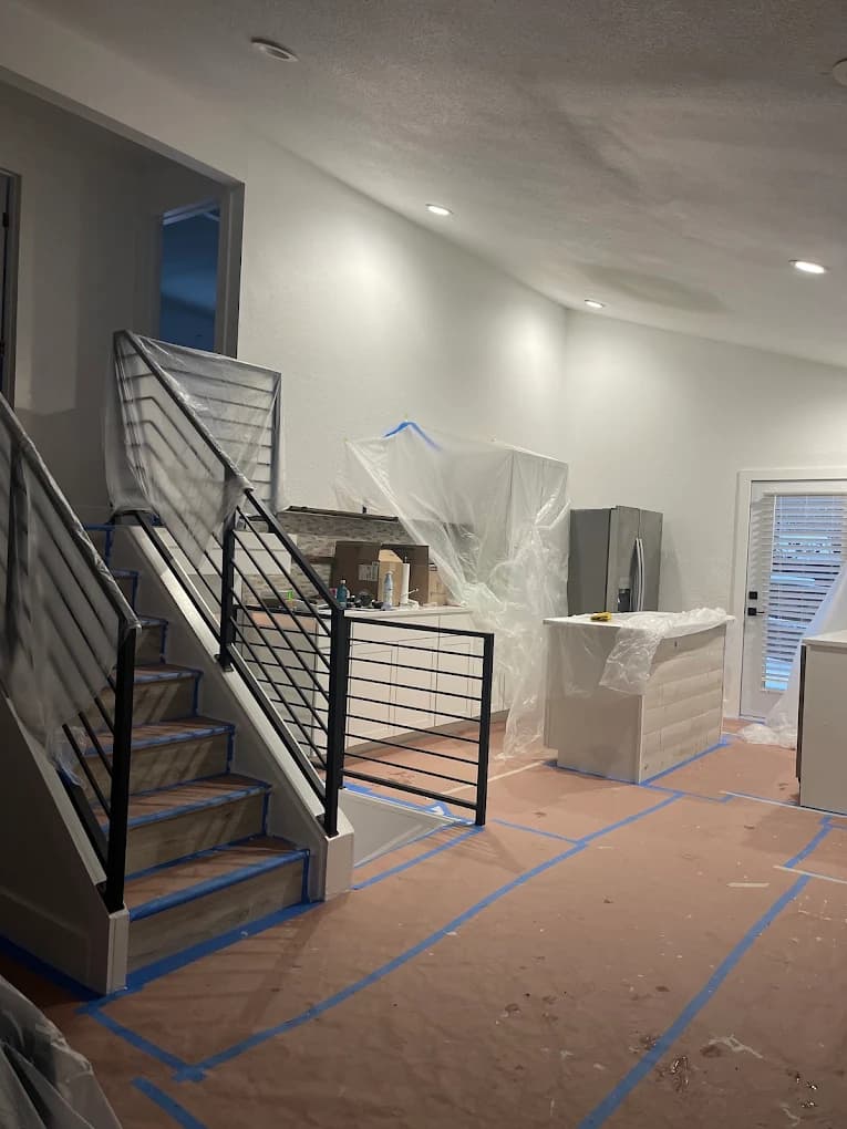 Stairwell and kitchen masked off during ceiling work