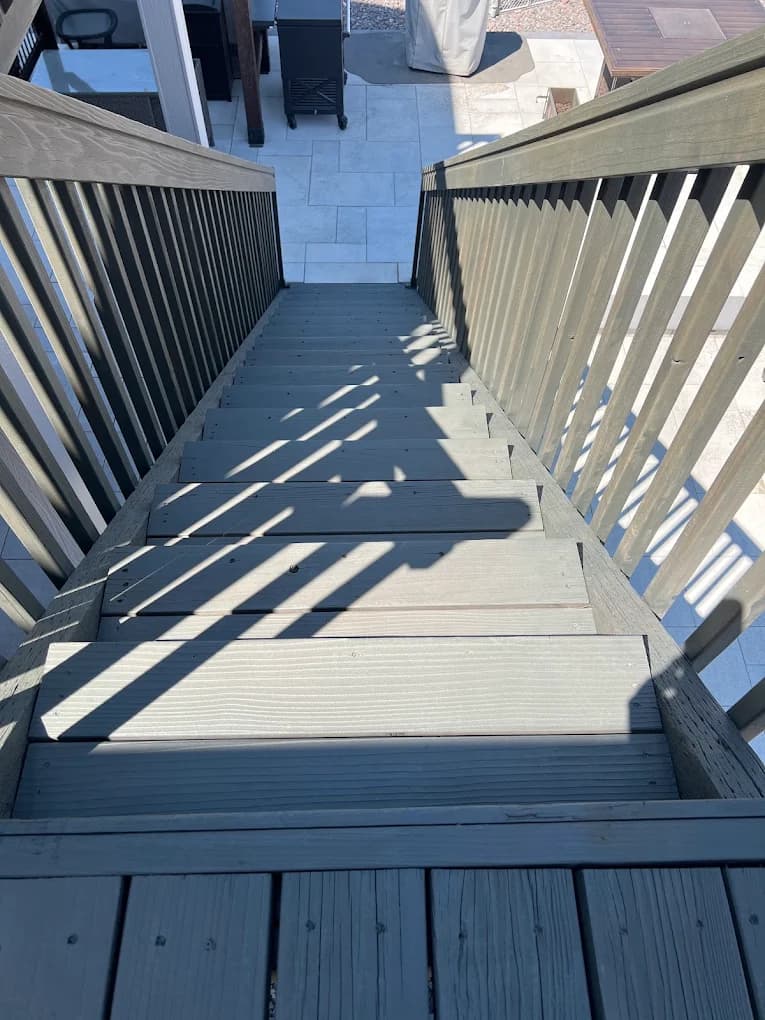 Deck staircase and railing finished in charcoal