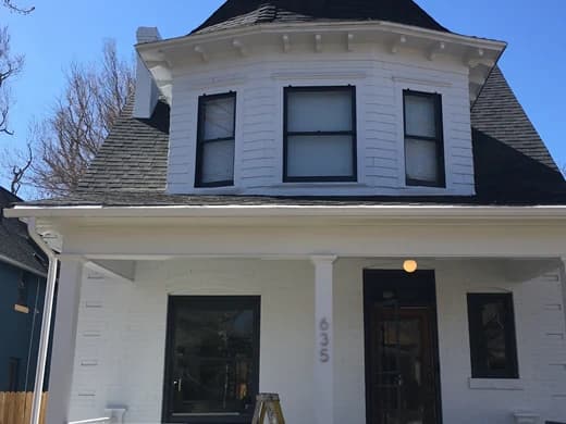 The same Victorian repainted white with black window frames