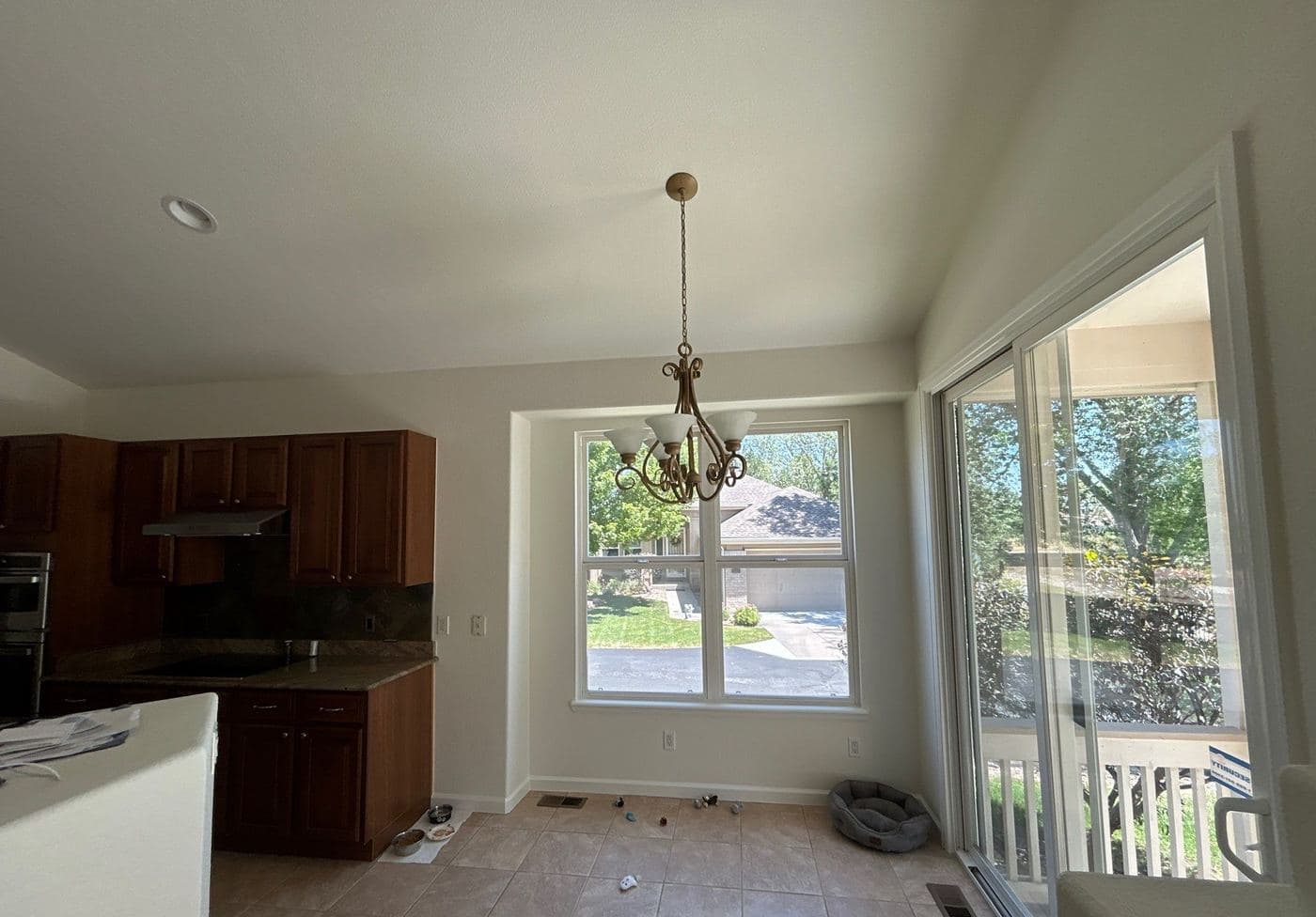 Open dining area with a smooth repainted ceiling
