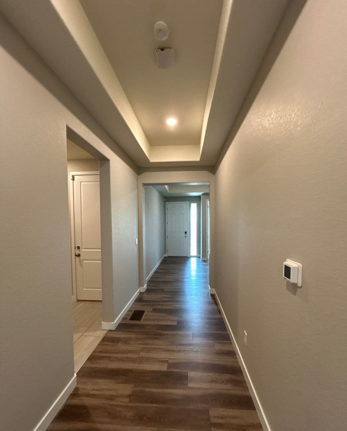 Hallway with a smooth tray ceiling after the texture came off