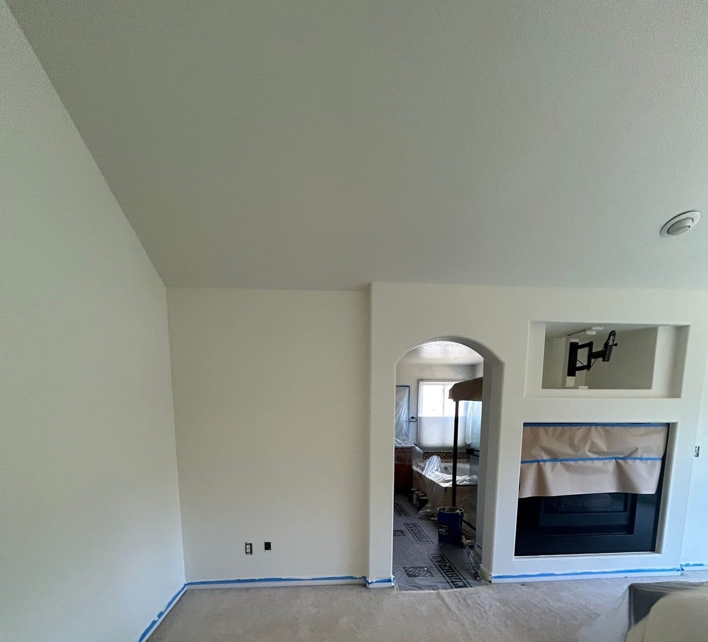 Sloped ceiling skimmed flat above a masked bedroom