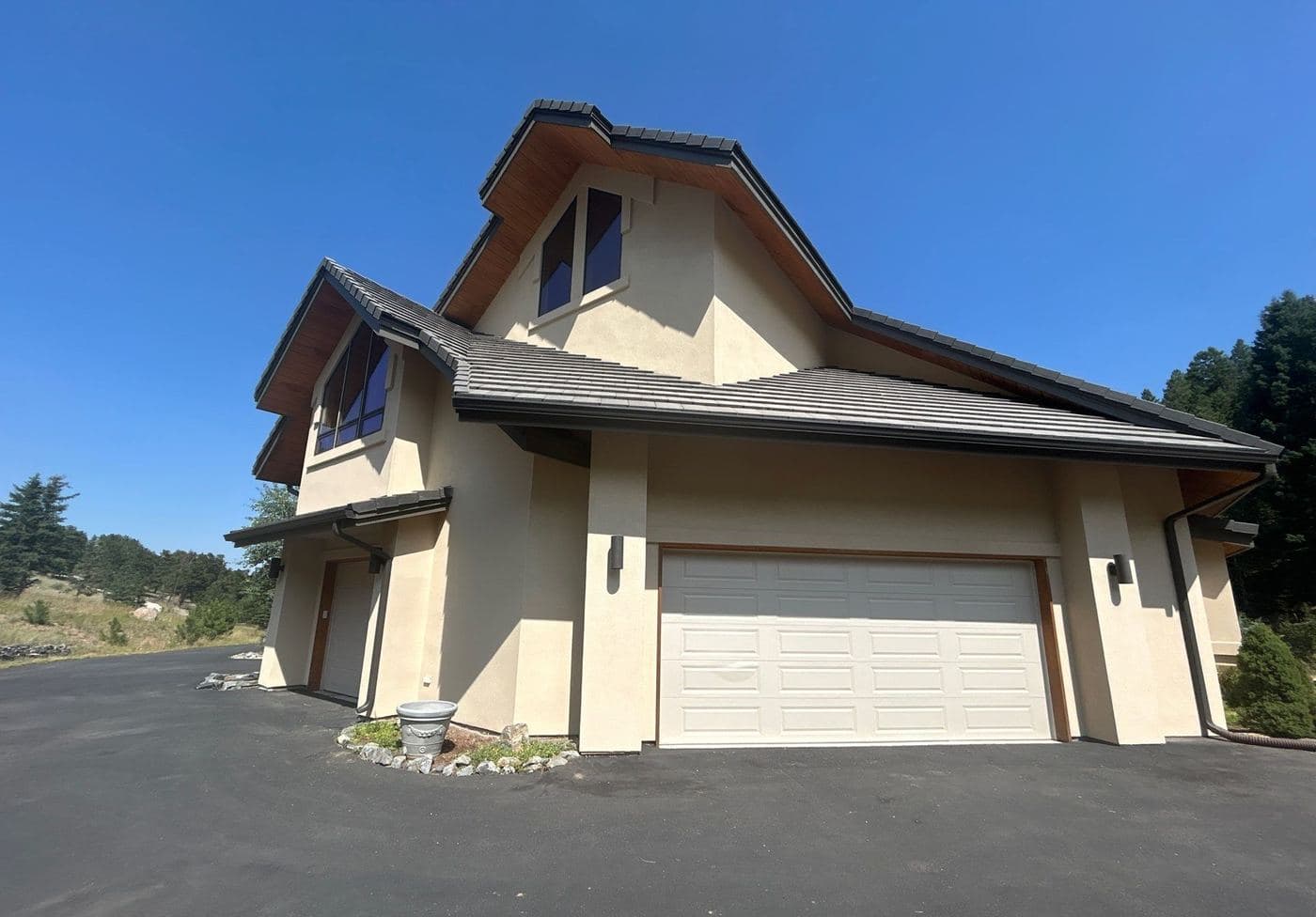 Two-storey exterior with repainted siding and white trim