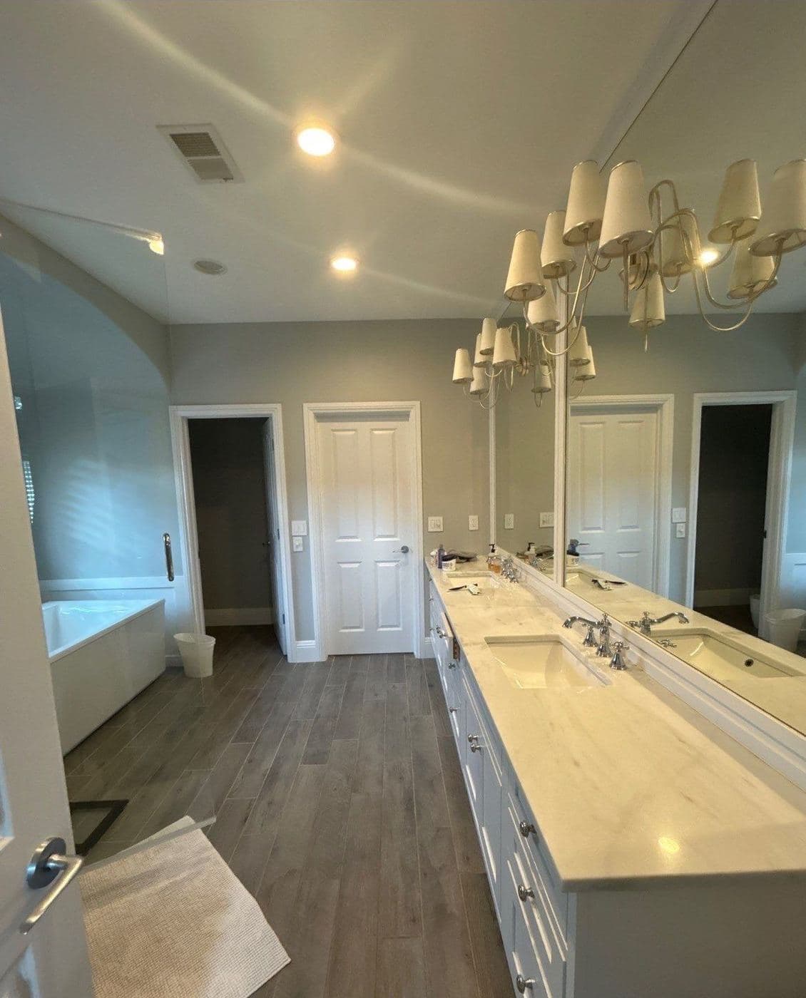Double vanity bathroom with repainted walls and cabinetry